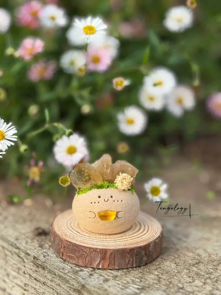 A Crysprout crowned with a honey-gold citrine cluster
