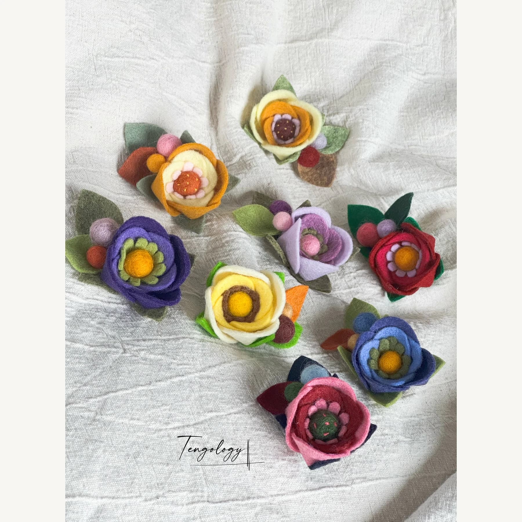 Layered felt flower brooch — Colourways together