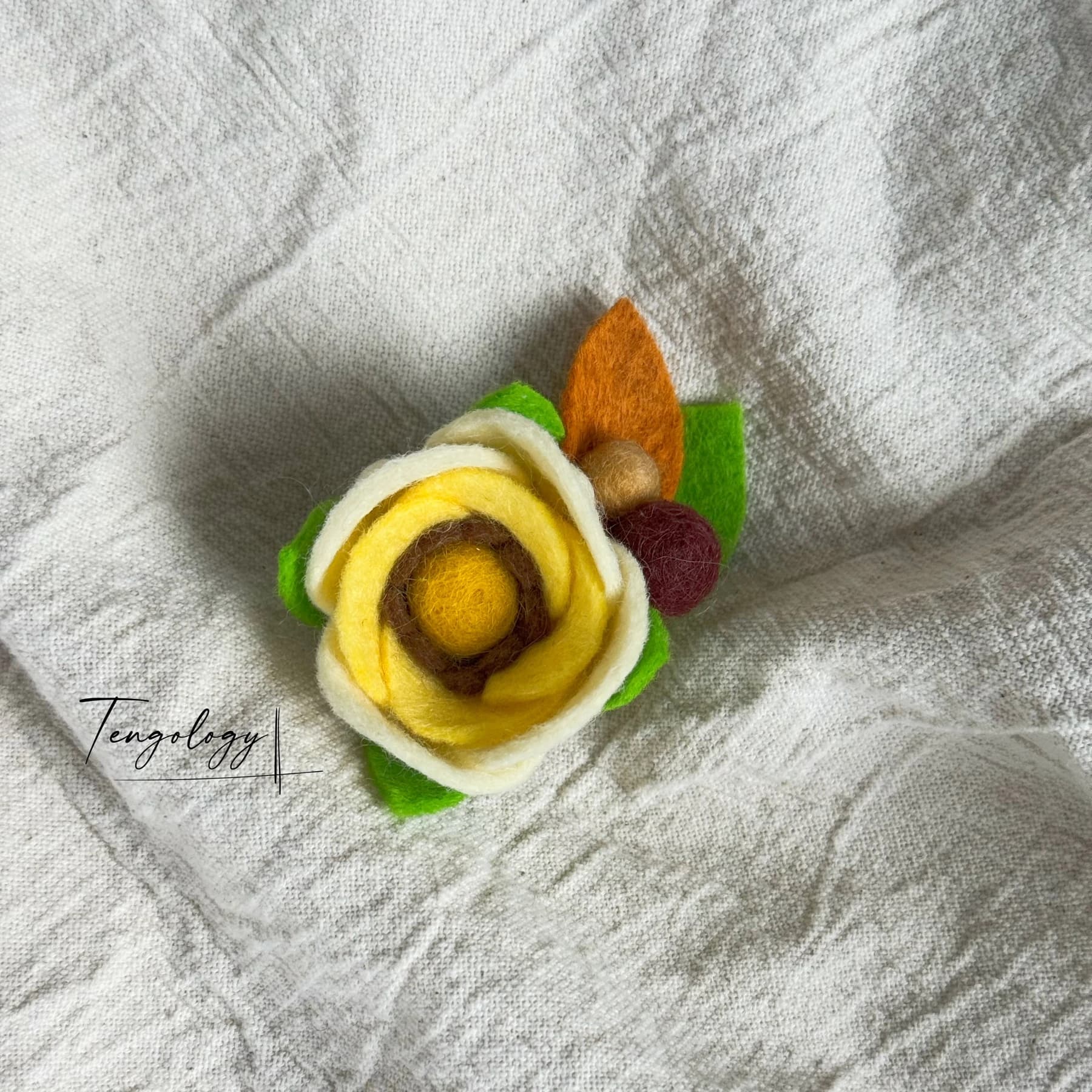 Layered felt flower brooch — Lemon yellow, front