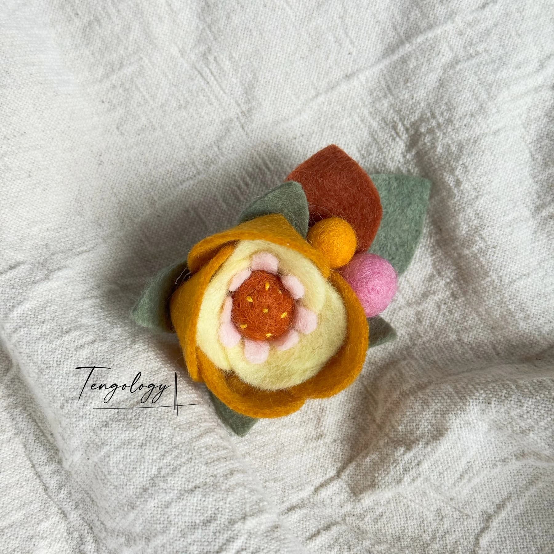 Layered felt flower brooch — Peach / orange, front