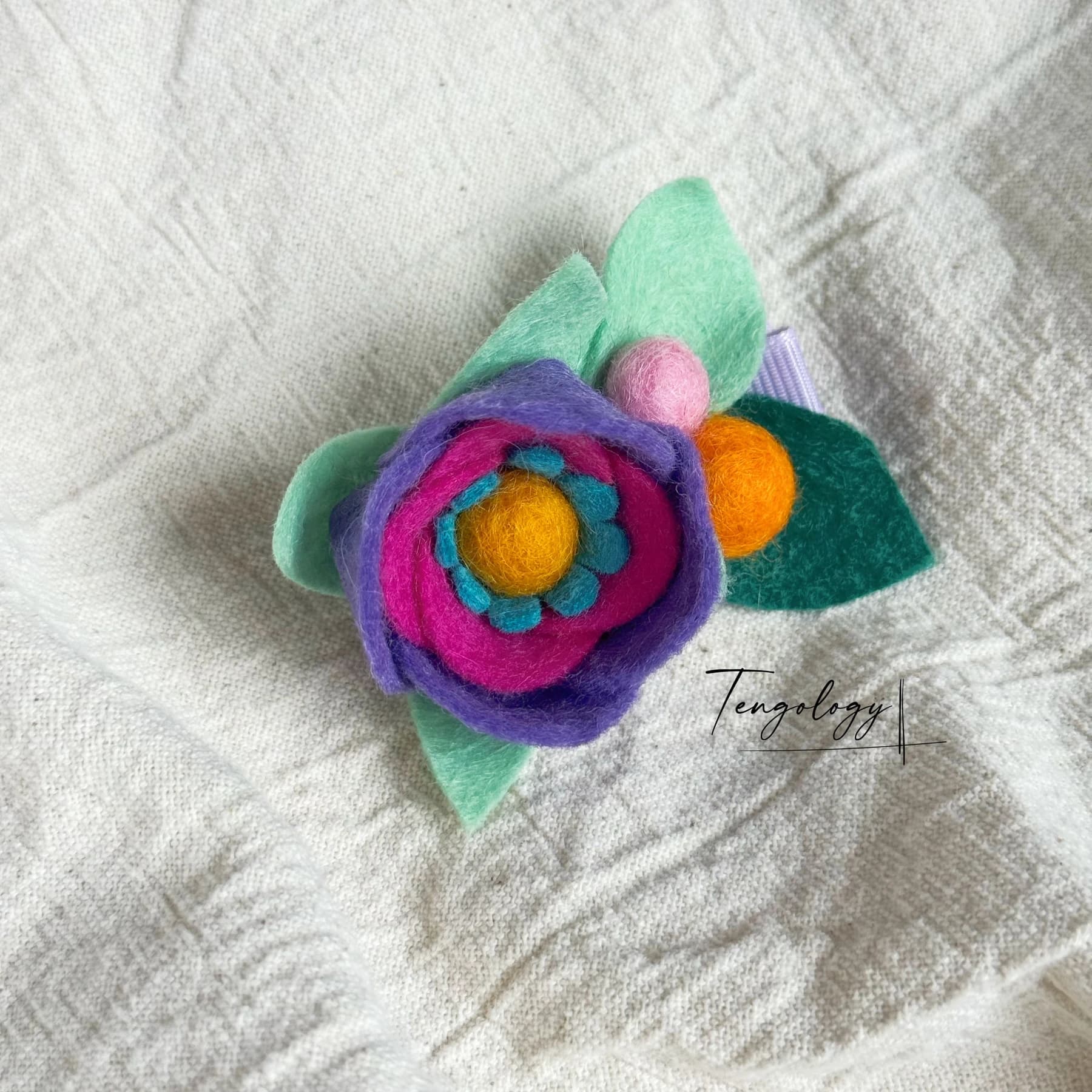 Layered felt flower hair clip — Purple / orange centre, front