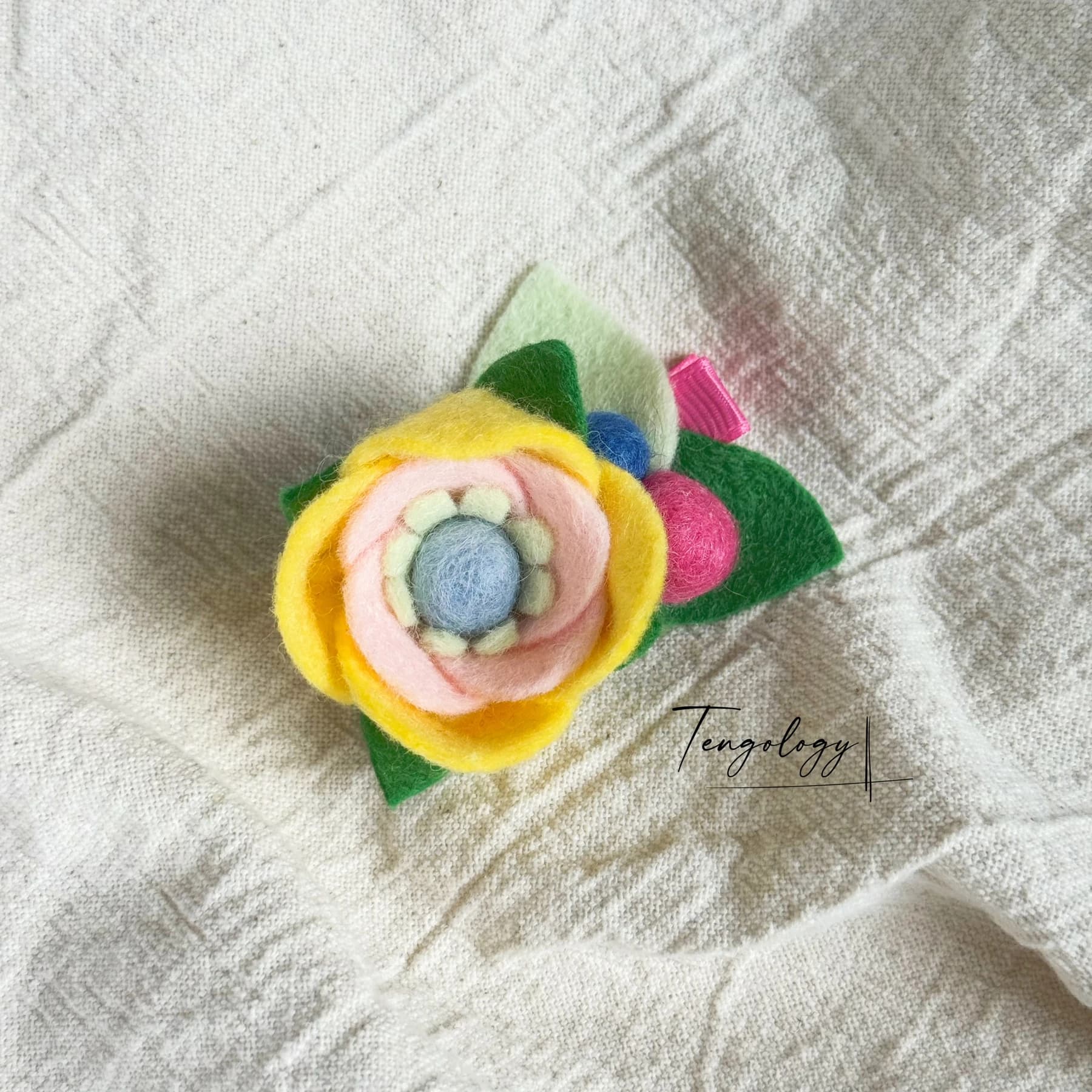Layered felt flower hair clip — Yellow / blue centre, front