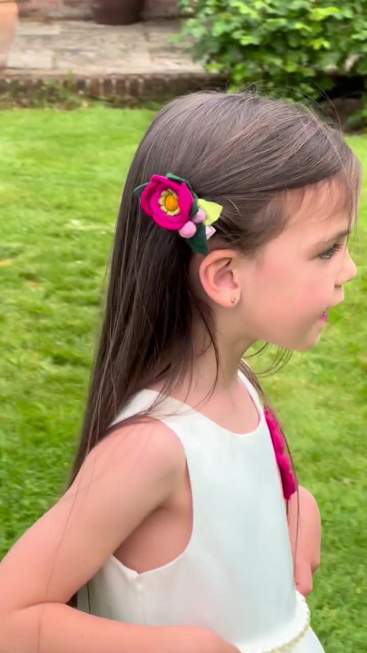 Layered felt flower hair clip — model demonstration video