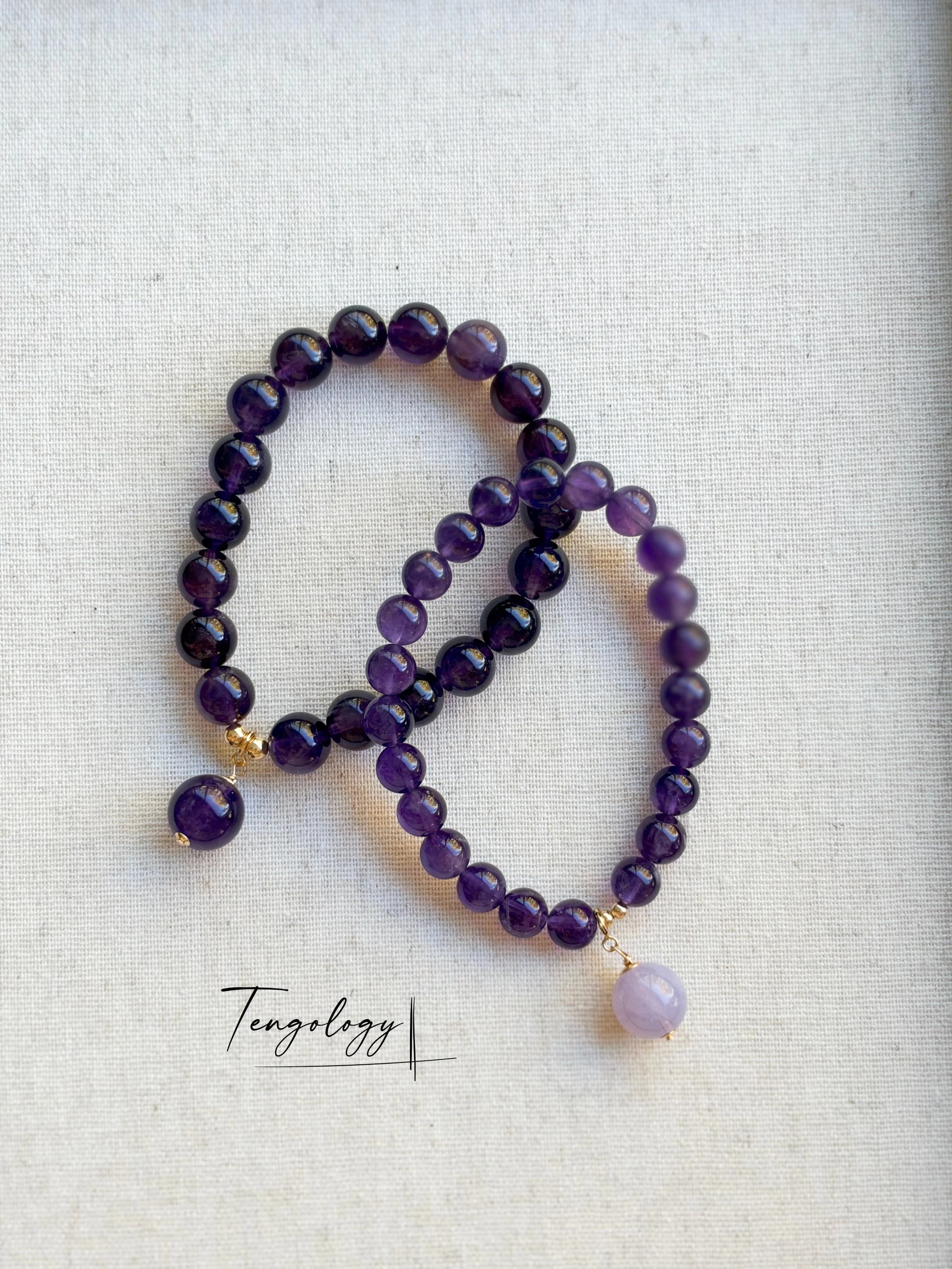 Pair with intention — Orbit — Amethyst pairing example. Bracelets and charms sold separately.