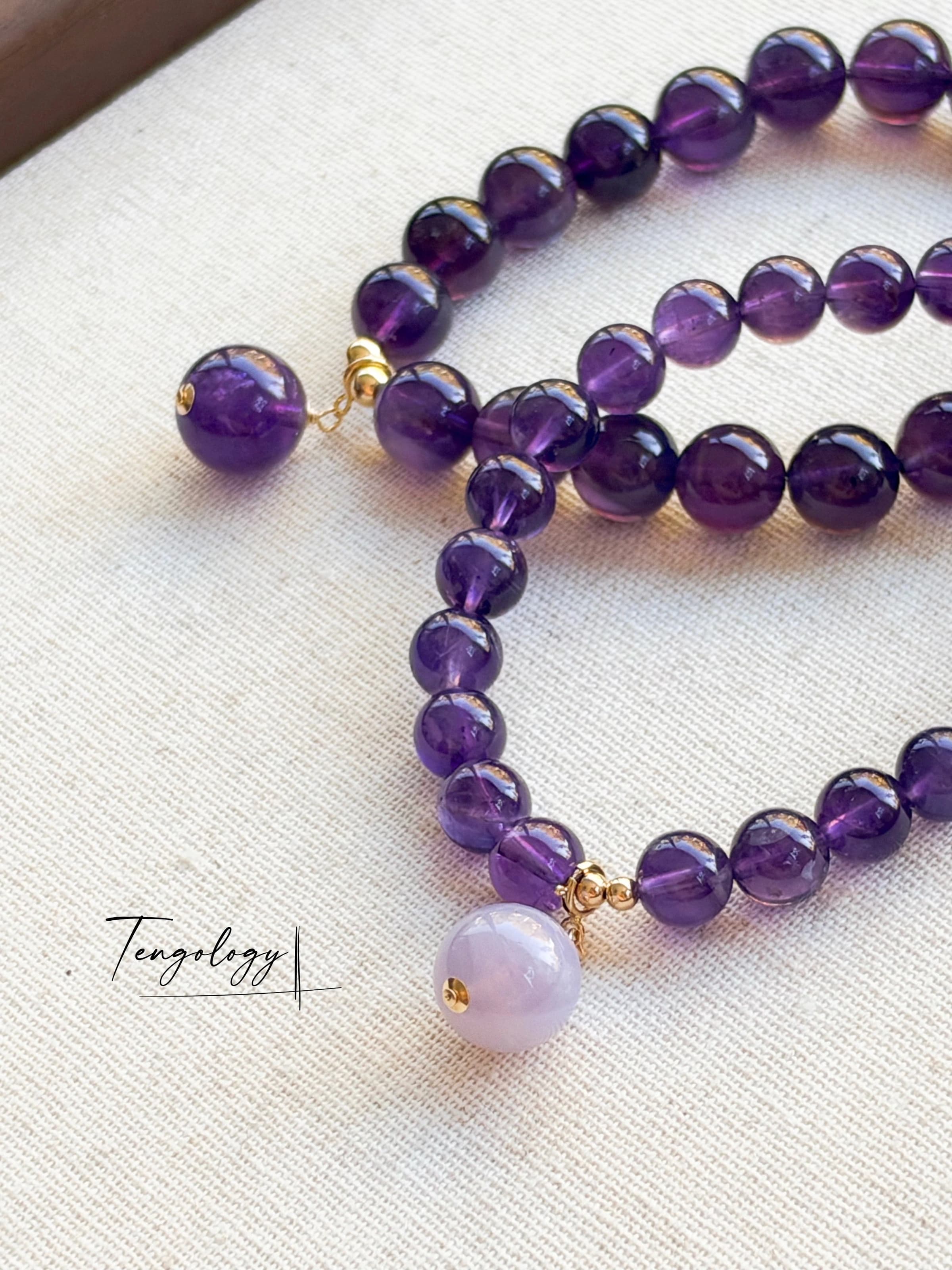 Pair with intention — Orbit — Amethyst pairing example. Bracelets and charms sold separately.