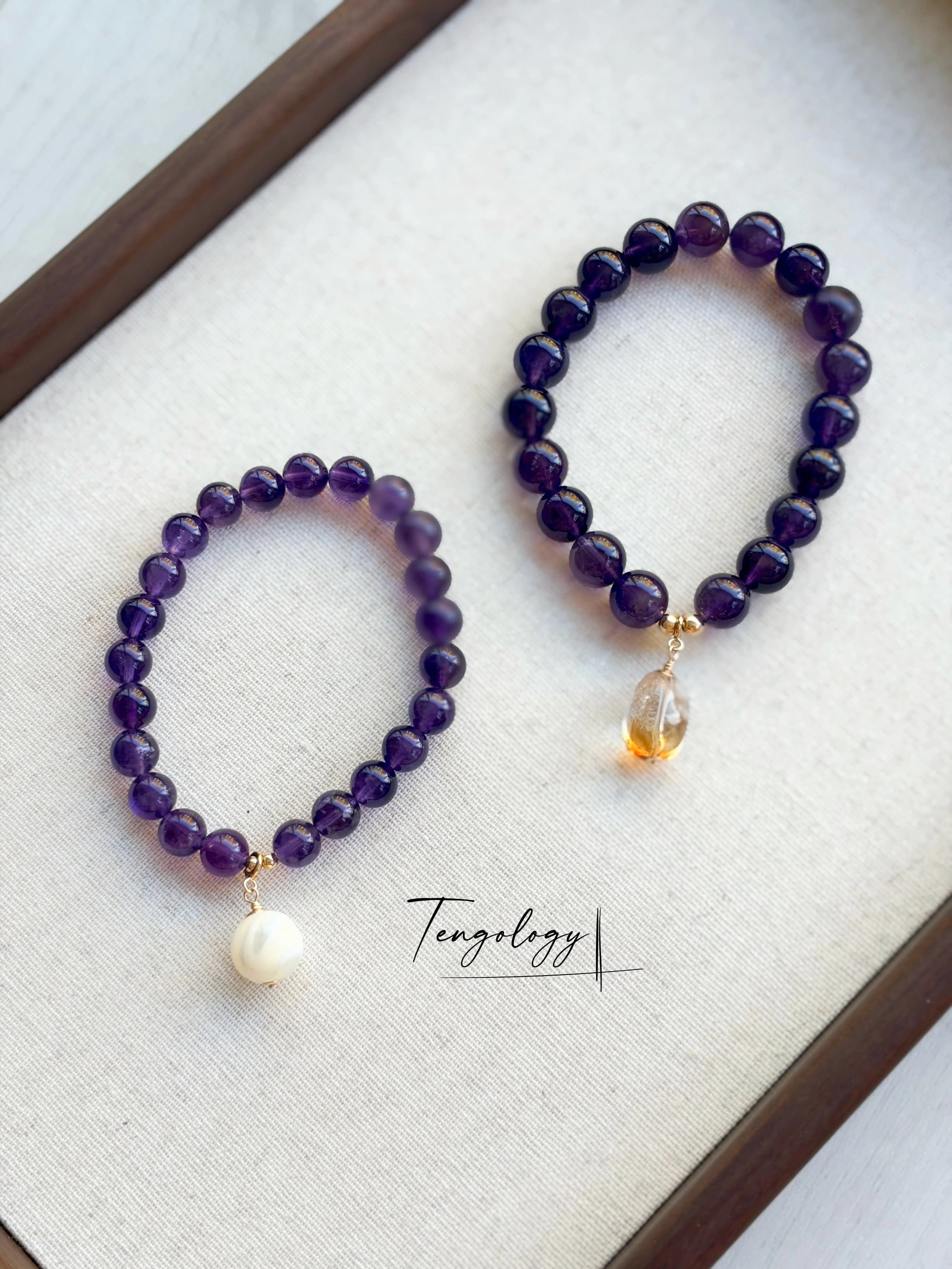 Pair with intention — Orbit — Amethyst pairing example. Bracelets and charms sold separately.