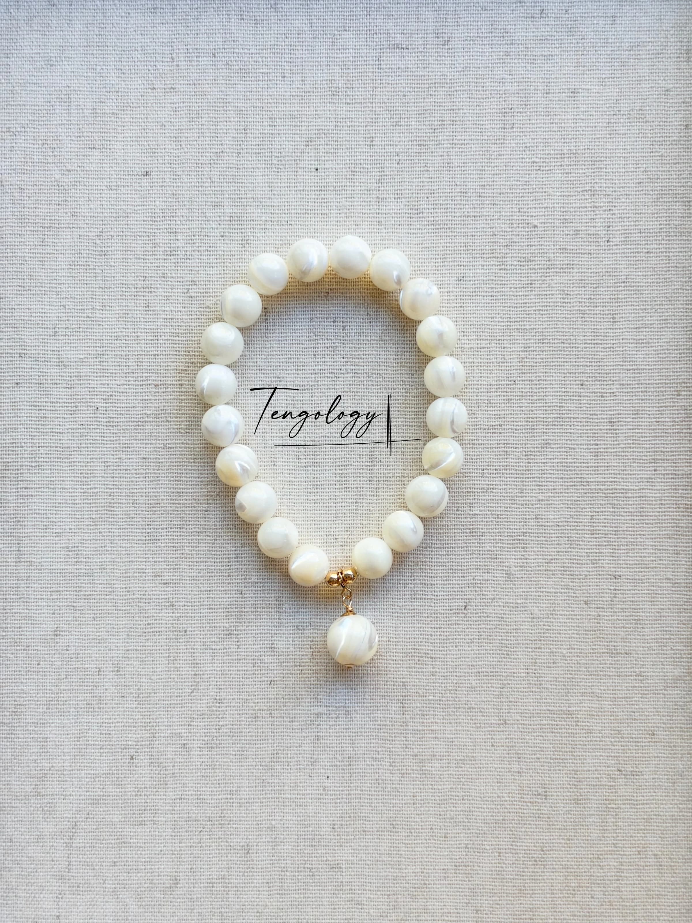 Pair with intention — Planet — Mother of Pearl pairing example. Bracelets and charms sold separately.