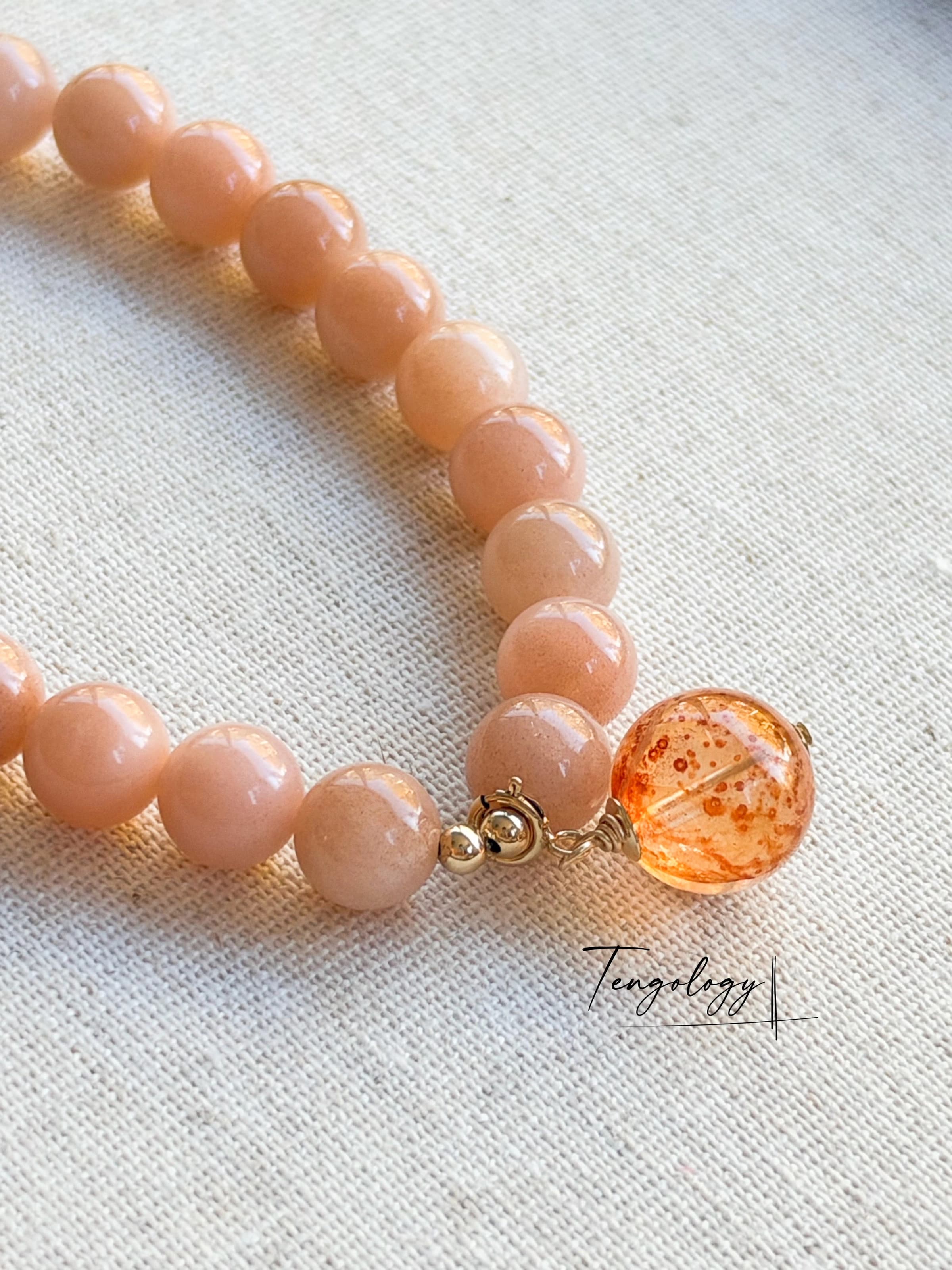 Pair with intention — Orbit — Orange Moonstone pairing example. Bracelets and charms sold separately.