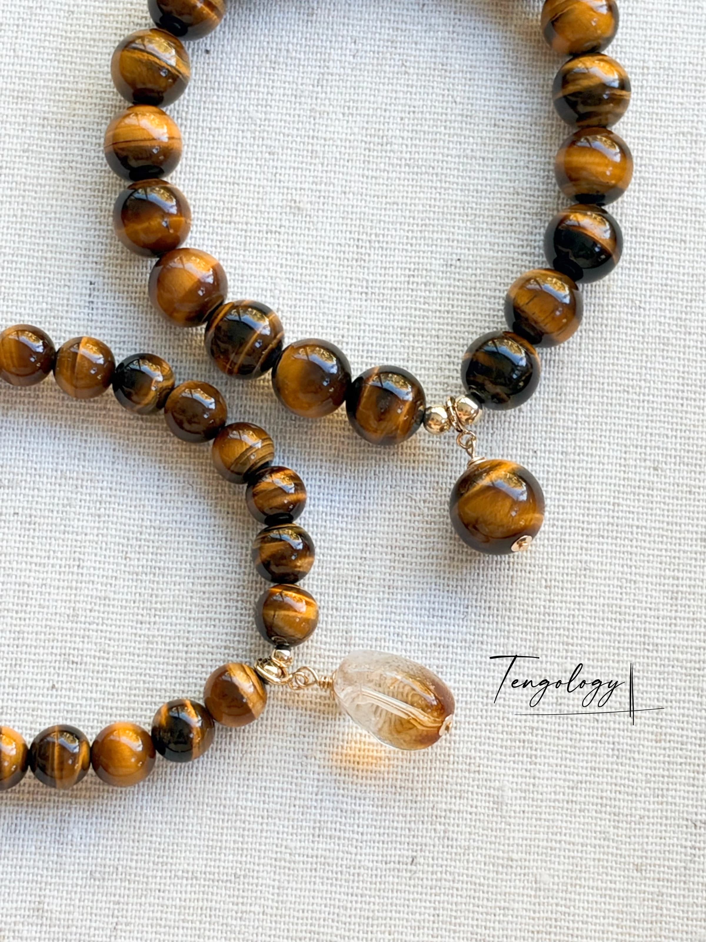 Pair with intention — Orbit Grande — Tiger’s Eye pairing example. Bracelets and charms sold separately.