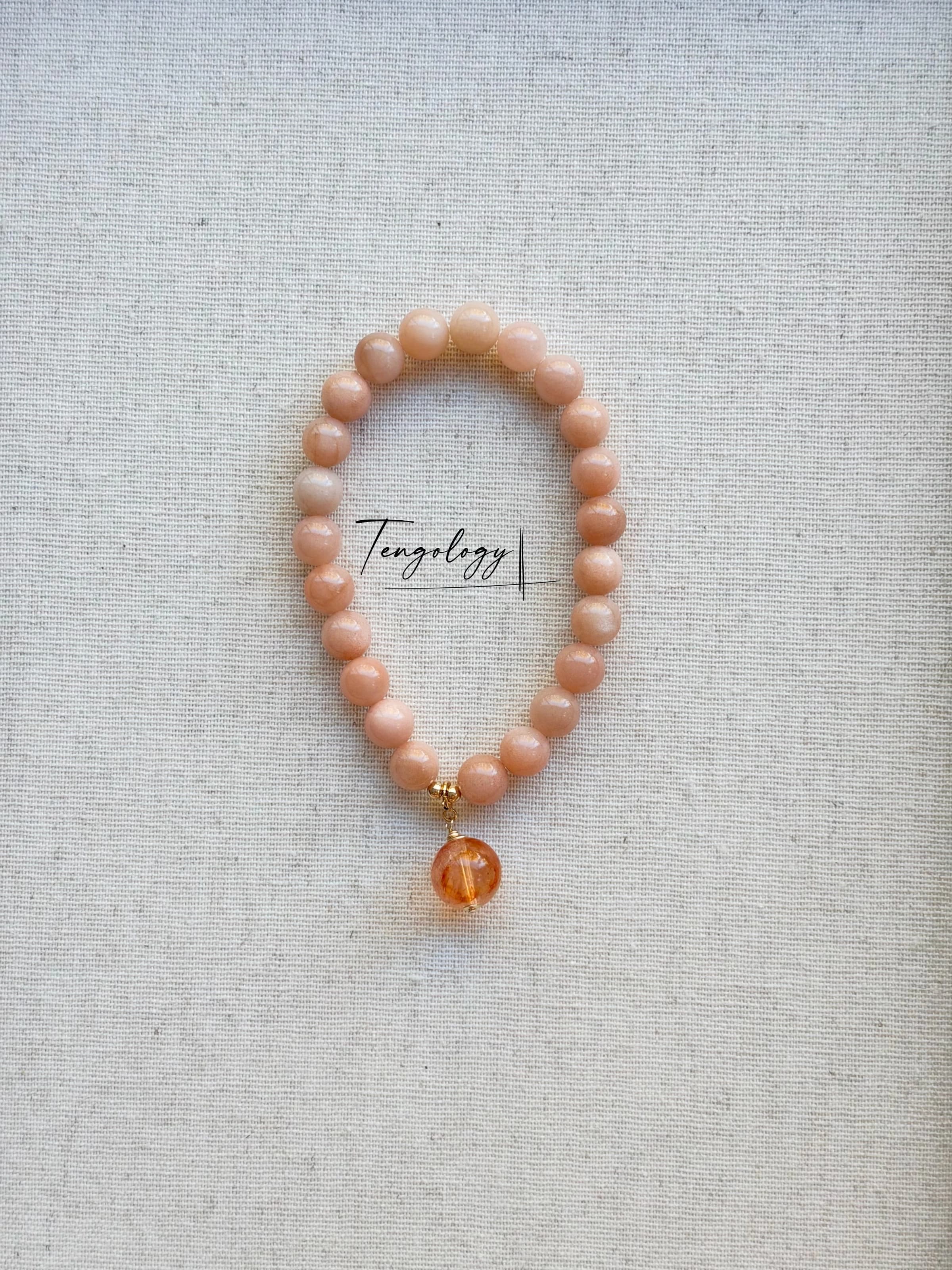 Pair with intention — Orbit — Orange Moonstone pairing example. Bracelets and charms sold separately.
