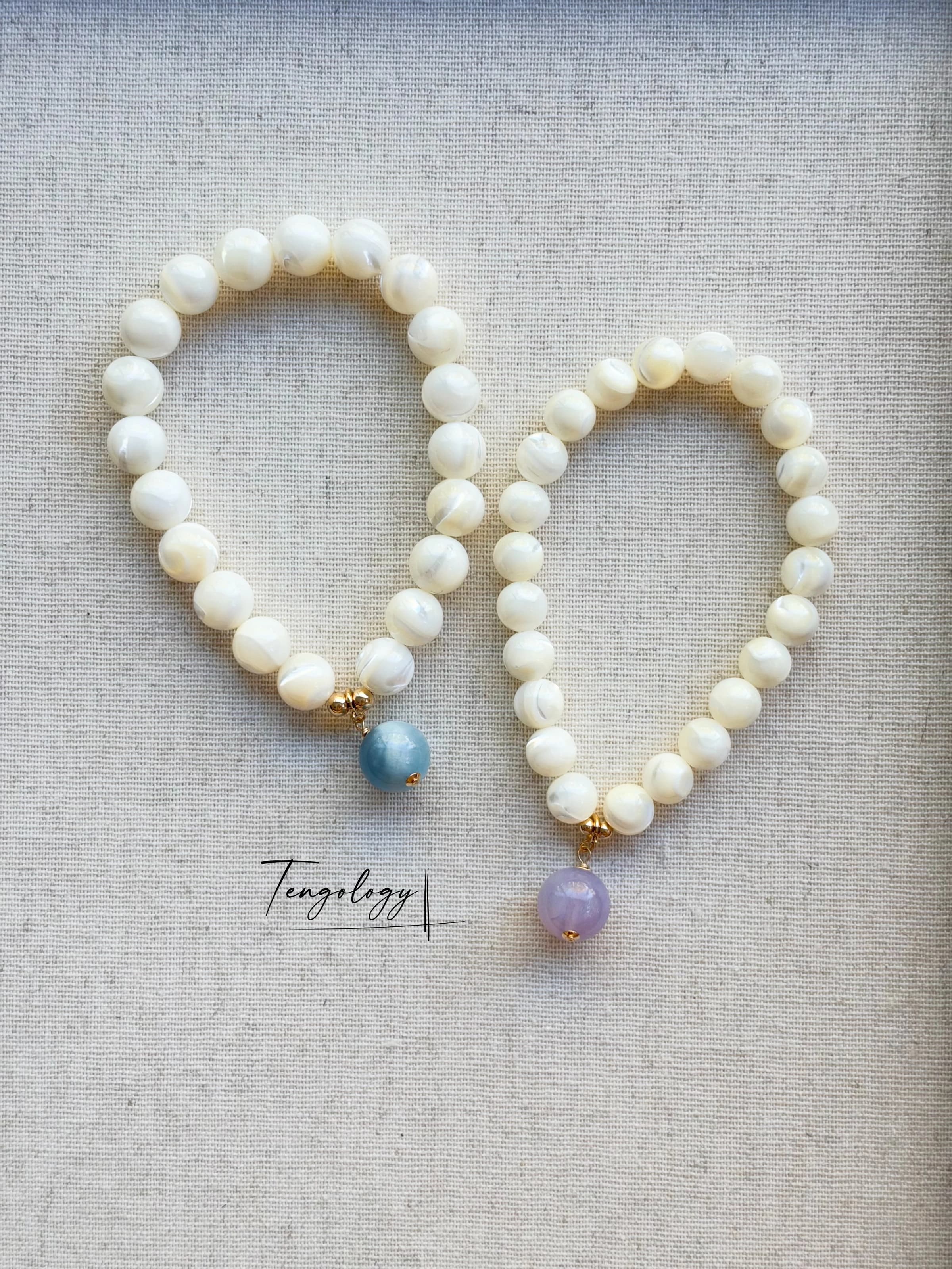 Pair with intention — Planet — Aquamarine pairing example. Bracelets and charms sold separately.