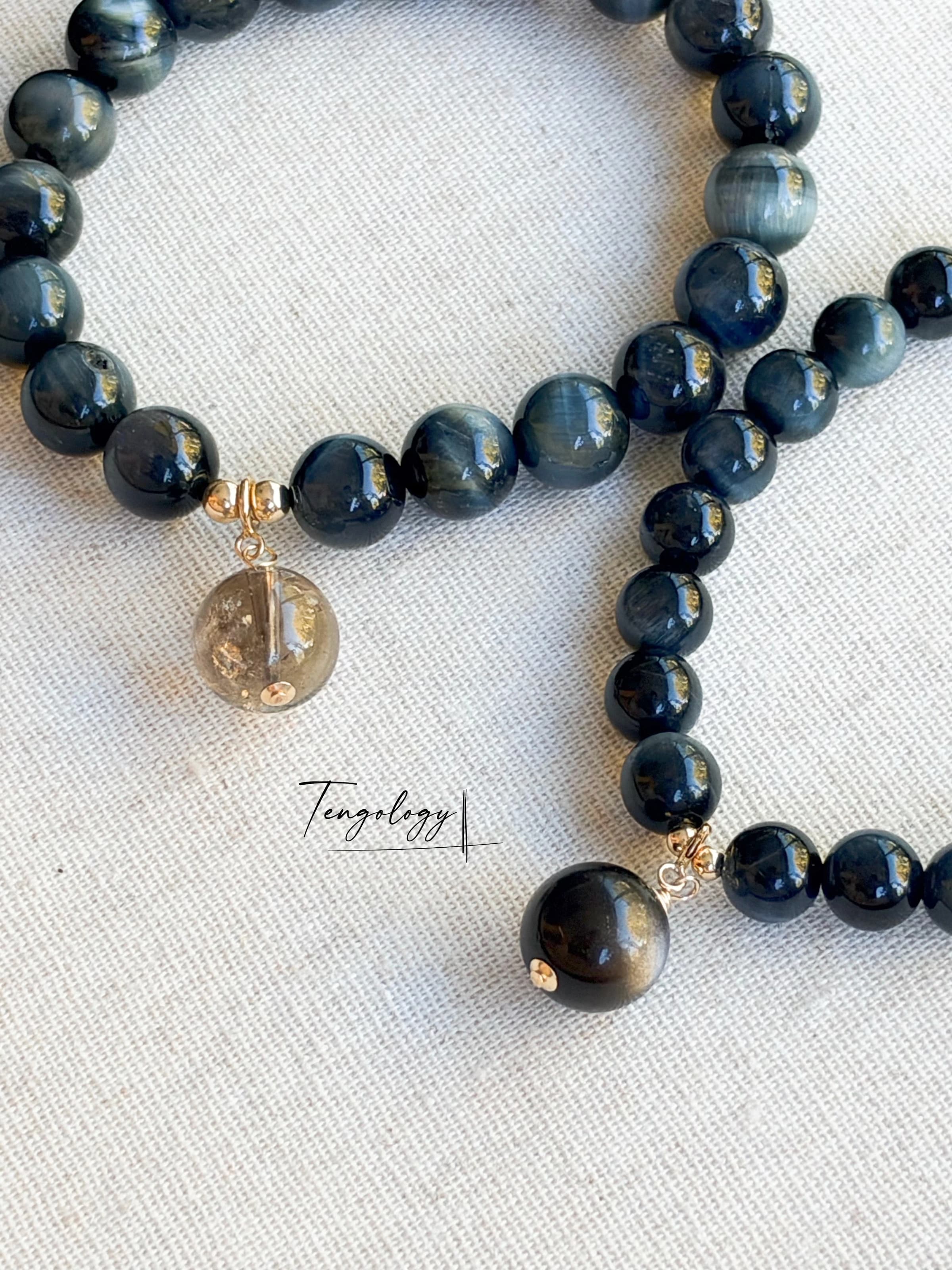 Pair with intention — Orbit — Blue Tiger’s Eye pairing example. Bracelets and charms sold separately.