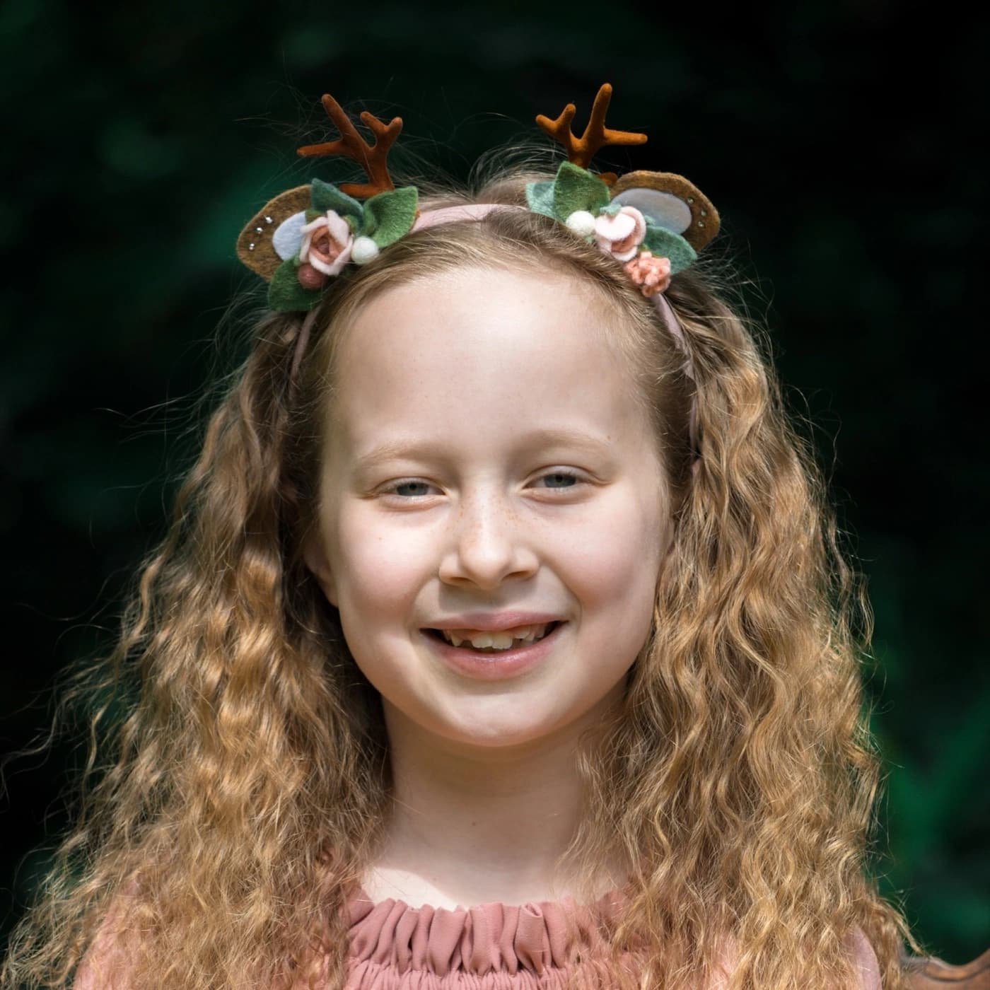 Blush / pink reindeer antler rose headband model photograph