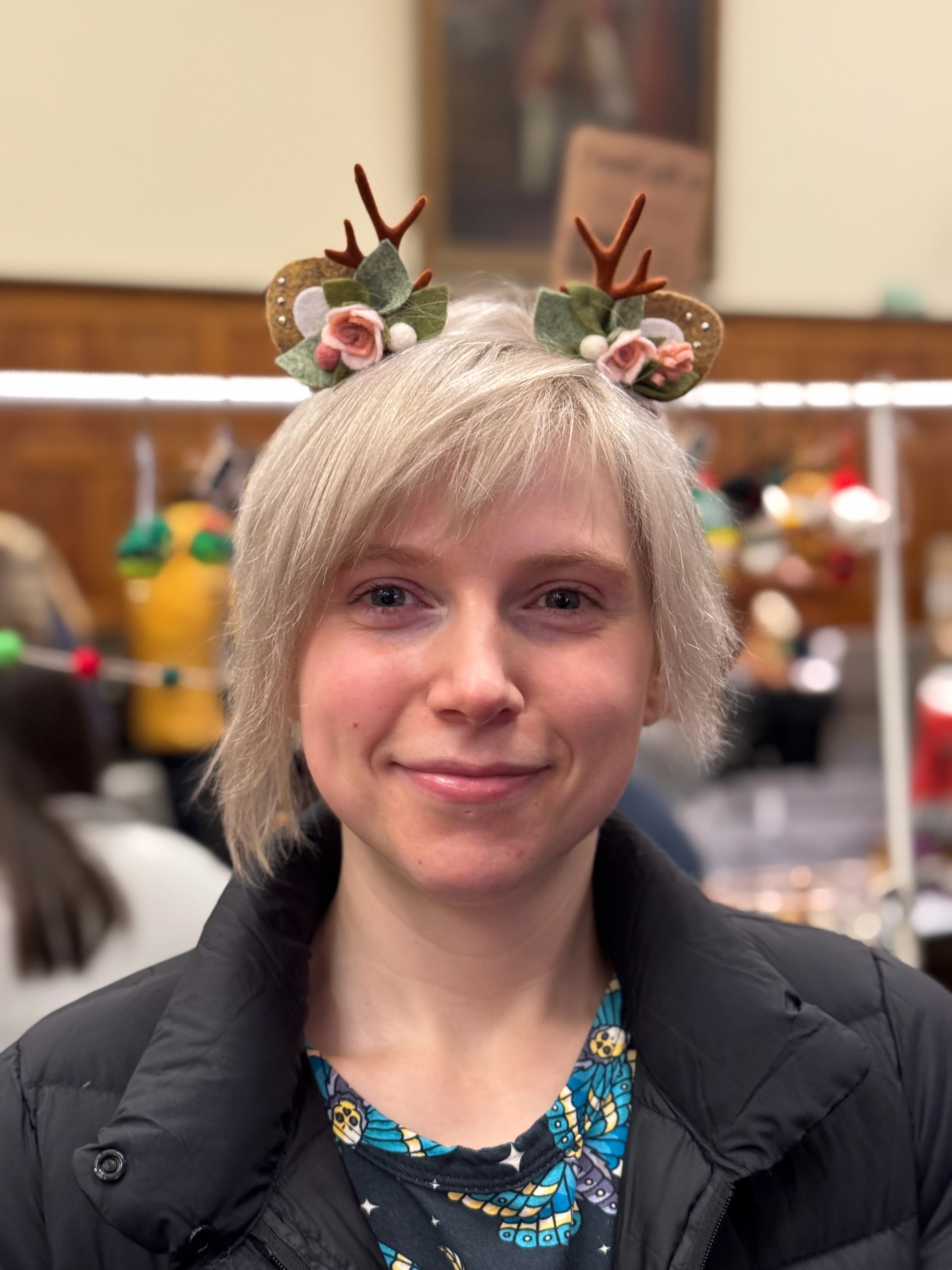 Blush / pink reindeer antler and rose hair clips worn by a customer