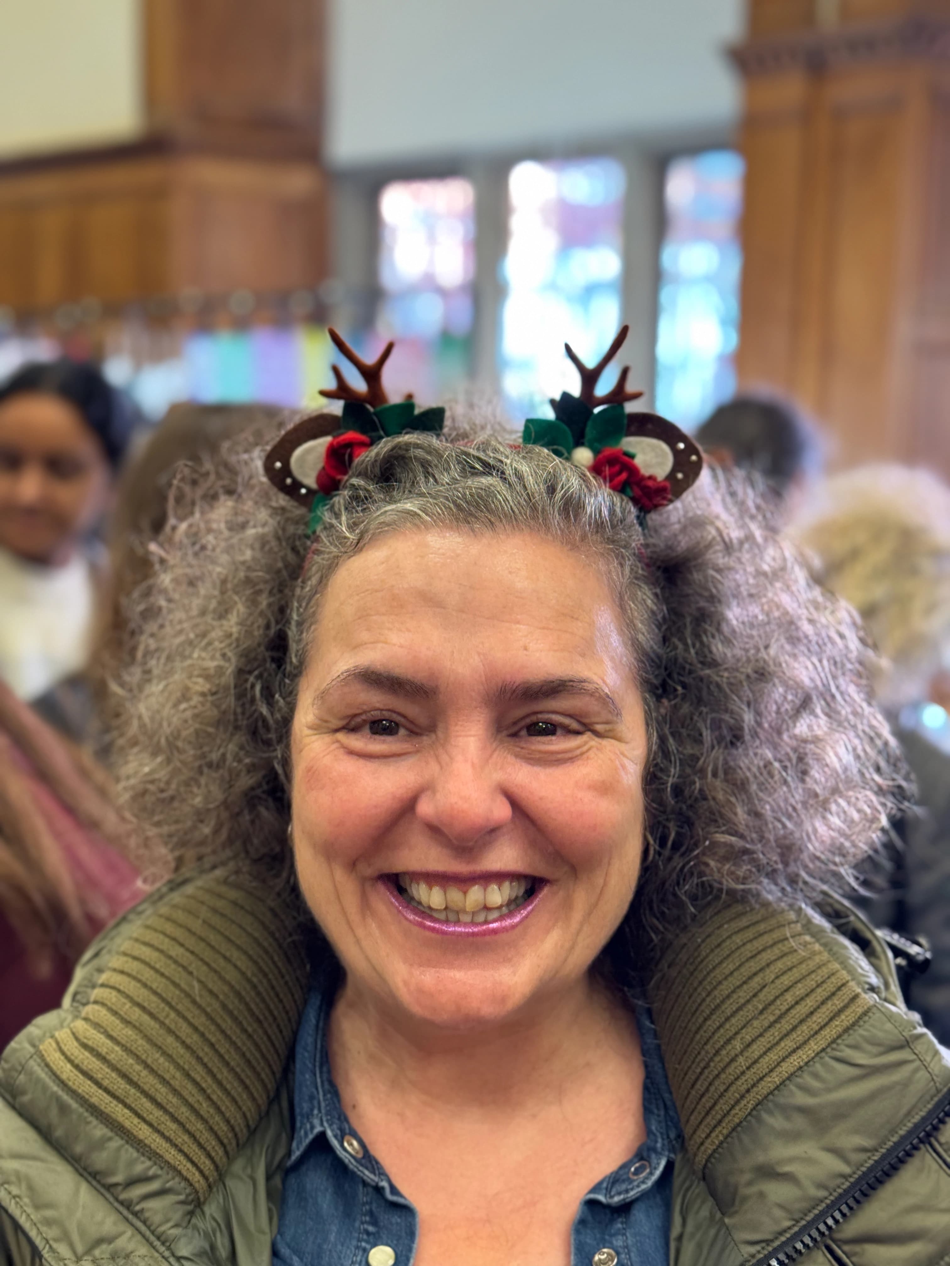 Red reindeer antler and rose headband worn by a customer