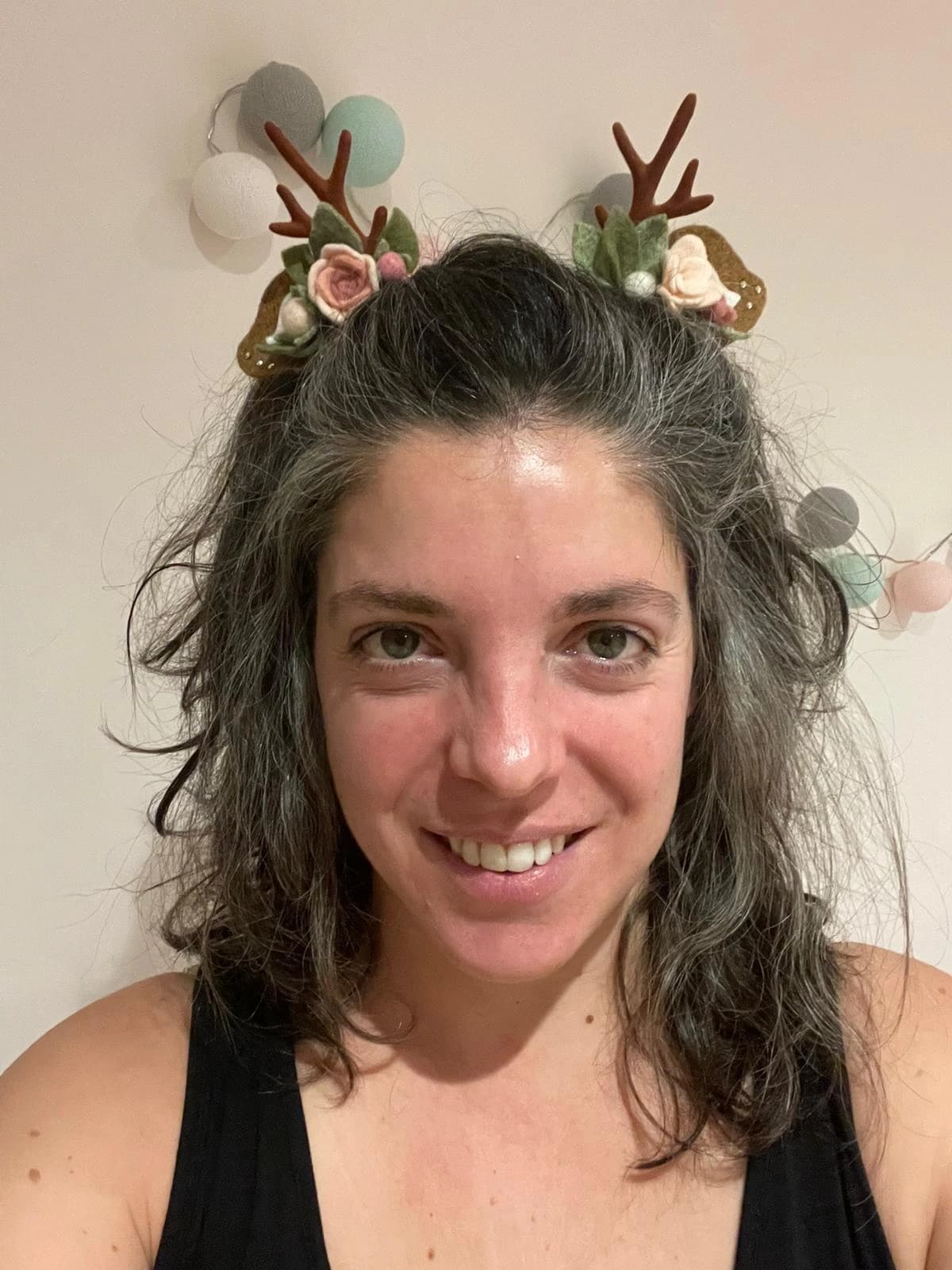 Blush / pink reindeer antler and rose hair clips worn by a customer